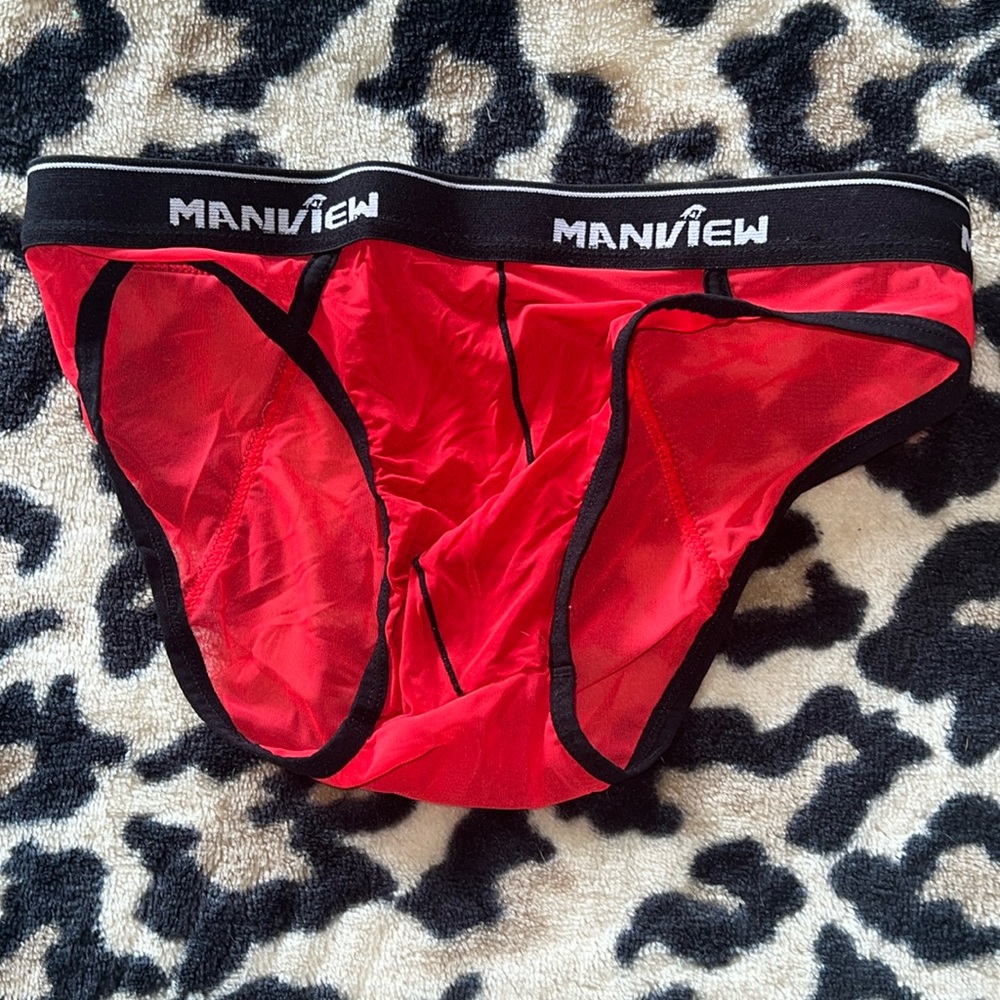 See through red men’s brief size small red with black band